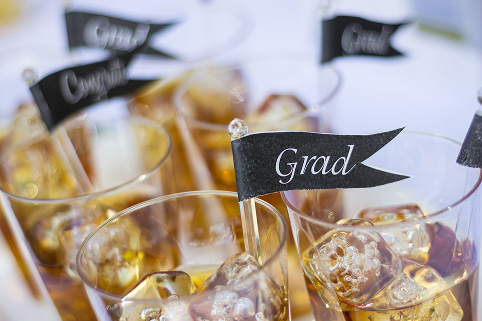 If you're planning a graduation celebration this summer, try enhancing the party with our DIY graduation drink stirrer banners using our swizzle sticks! #GraduationParty #DIY